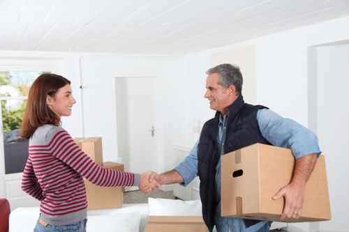 Professional small removals team transporting office items in South Wimbledon