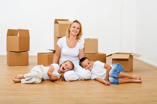 Packed moving boxes and furniture ready for transport during a South Wimbledon relocation